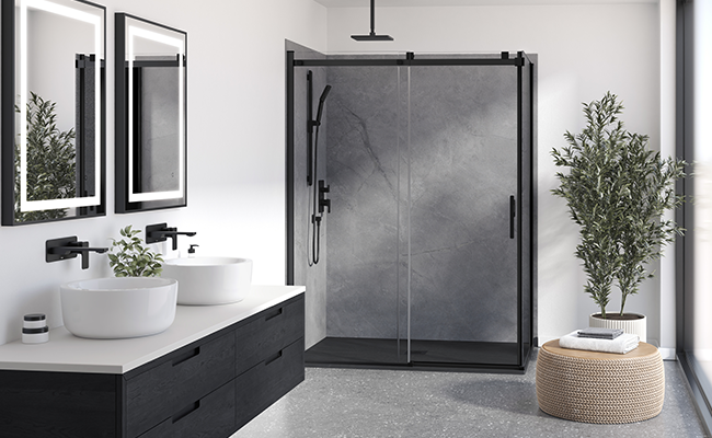 A black and grey shower space with Kalia faucets.